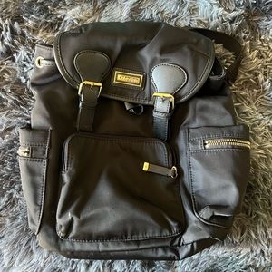 Calvin Klein Snap closure small backpack. Barely used, Like new.